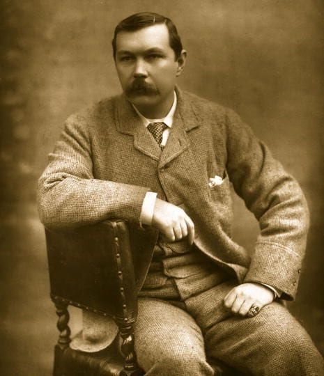 Portrait or photograph of Arthur Conan Doyle: Photograph of Arthur Conan Doyle, seated sideways on chair. Published in "Men and Women of the Day 1893", Eglingto