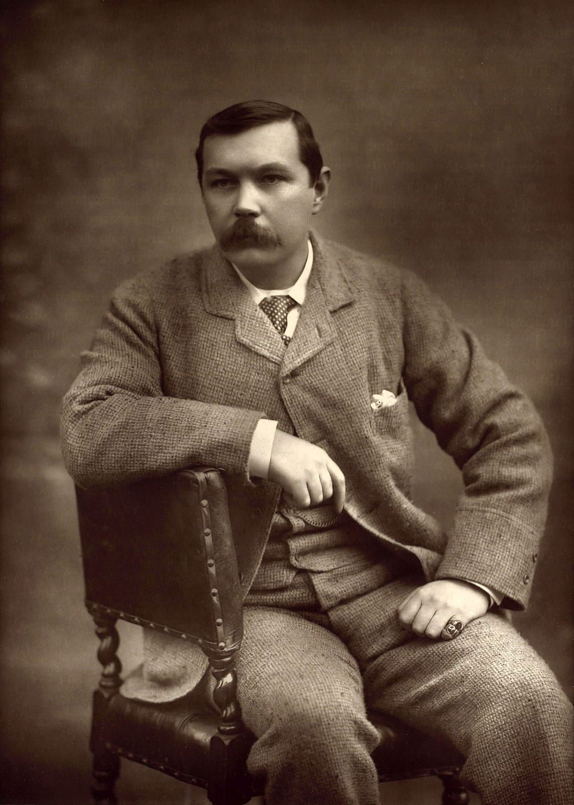 Portrait or photograph of Arthur Conan Doyle: Black and white photograph of Sir Arthur Ignatius Conan Doyle by the English photographer Herbert Rose Barraud. Ca