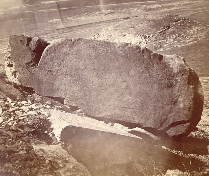 Portrait or photograph of Ashoka: Photograph of the rock with Asoka inscriptions at Shahbazgarhi, Peshawar District, showing the eastern face with the edicts I-