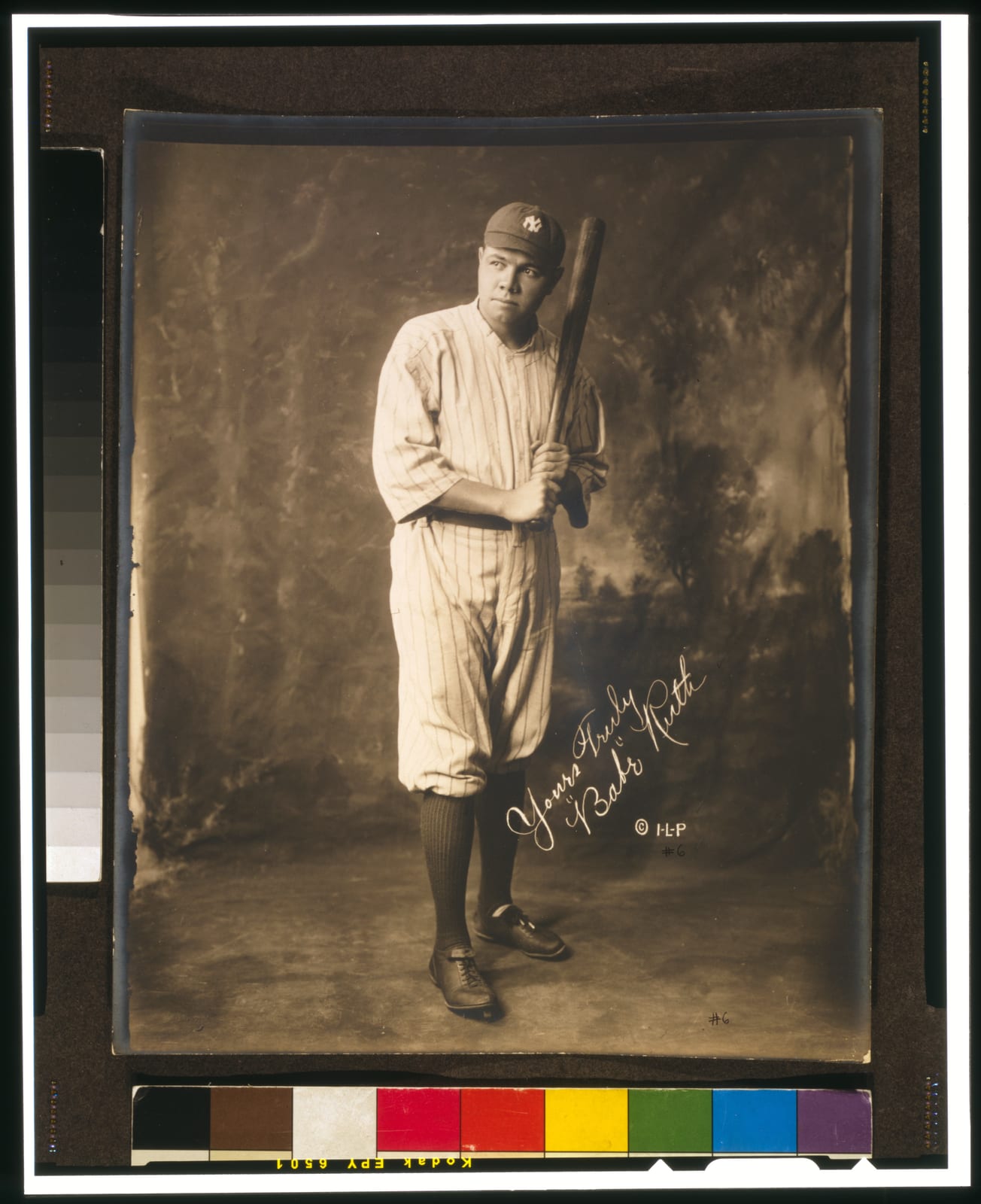 Portrait or photograph of Babe Ruth: Babe Ruth , full-length portrait, standing, facing slightly left, in baseball uniform, holding baseball bat. Signed on imag