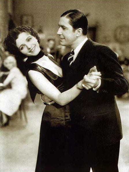 Portrait or photograph of Carlos Gardel: Mona Maris and Carlos Gardel in the film Cuesta Abajo (1934).
