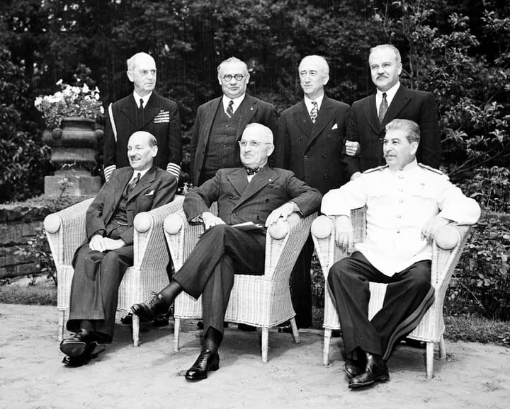 Portrait or photograph of Clement Attlee: Seated in the garden of Cecilienhof Palace in Potsdam, Germany, L to R: British Prime Minister Clement Attlee, Preside
