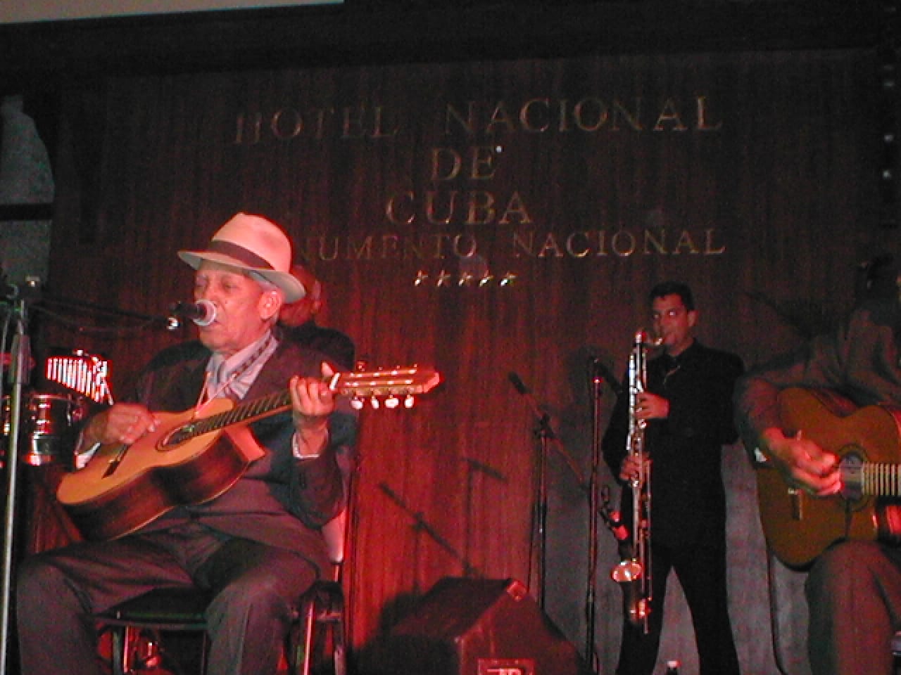 Portrait or photograph of Compay Segundo: Compay Segundo playing at the Hotel Nacional de Cuba, Havana, Cuba. October 2002.