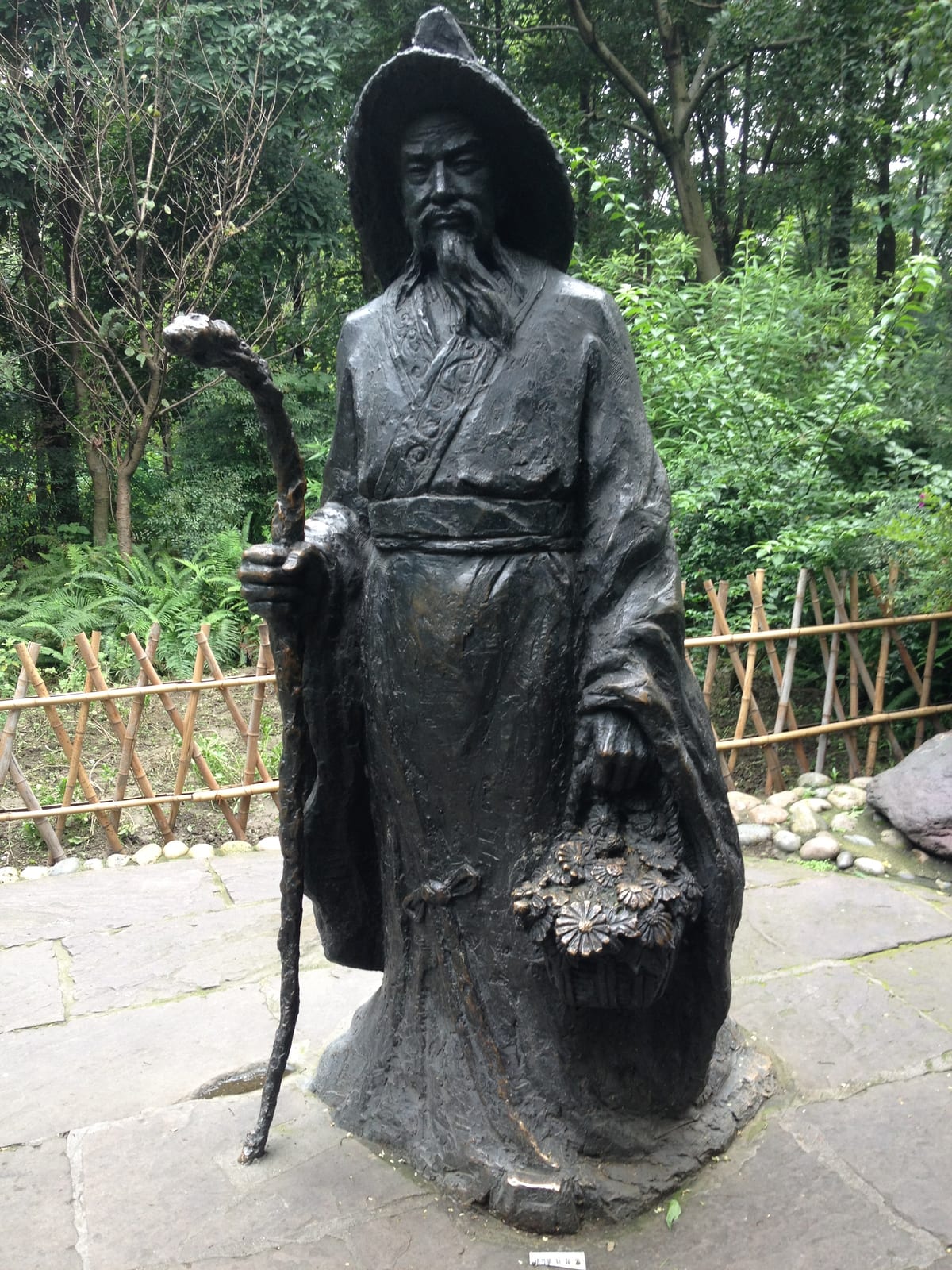 Memorial or place connected to Du Fu: Bronze (?) statue of the Chinese Tang Dynasty poet Du Fu (c. 712 - 770) in Chengdu, Sichuan, China.