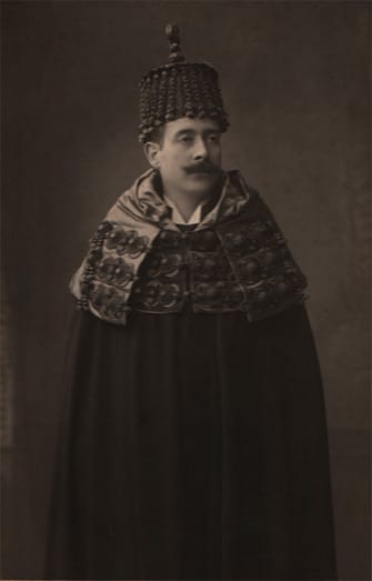 Portrait or photograph of Egas Moniz: António Egas Moniz wearing the traditional doctoral regalia ("borla e capelo") from the University of Coimbra.