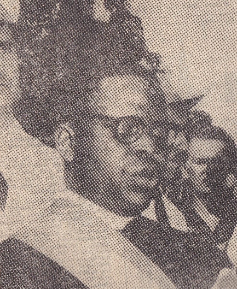Portrait or photograph of Fulbert Youlou: Fulbert Youlou wearing sash, at ceremony giving speech