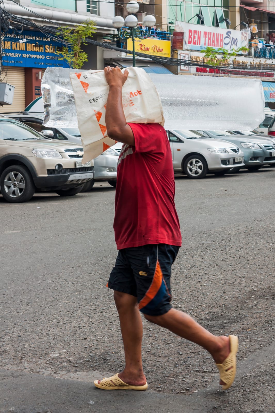 Portrait or photograph of Ho Chi Minh: Ho Chi Minh City, Vietnam: Man, delivering ice blocks