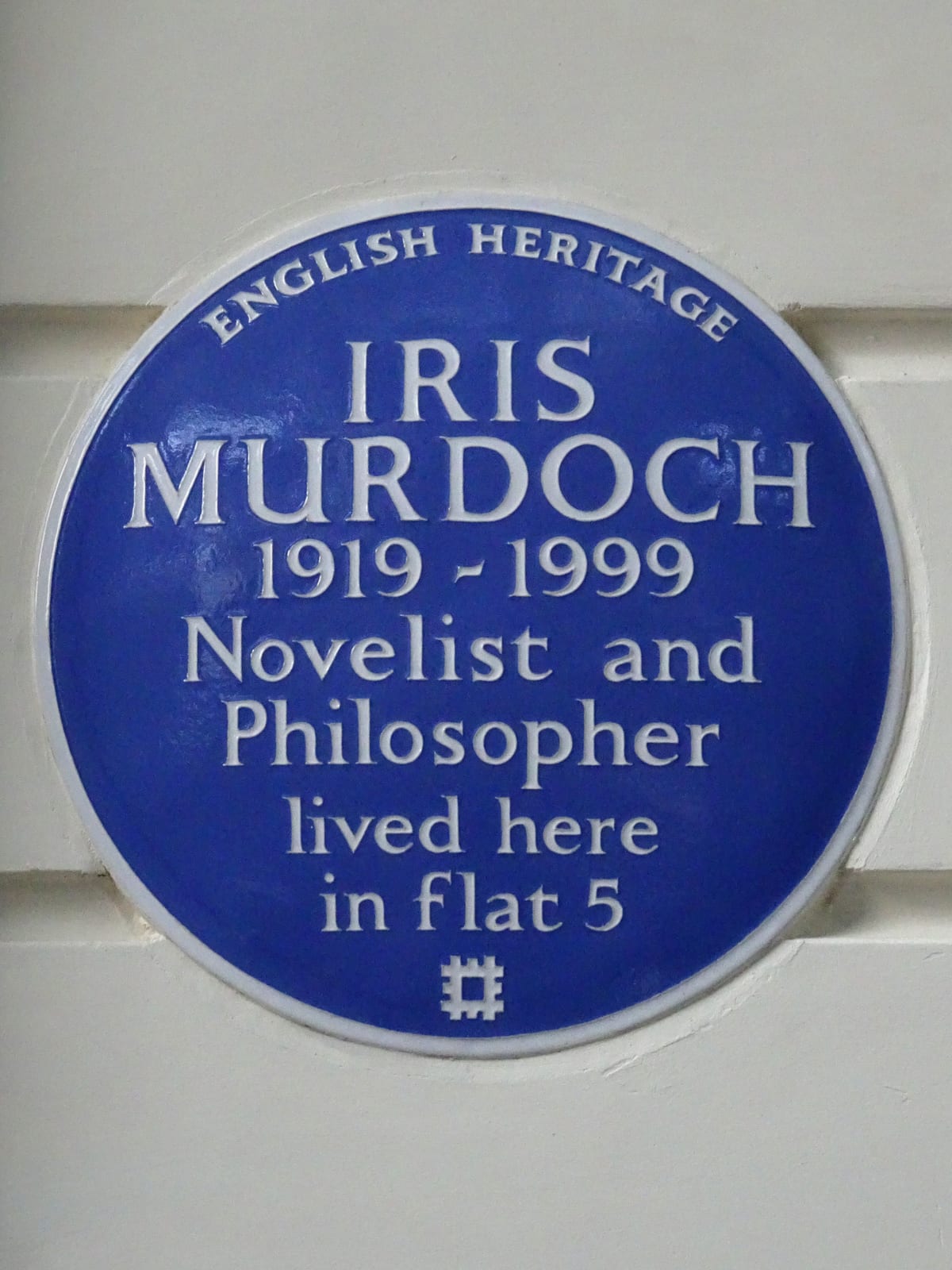 Portrait or photograph of Iris Murdoch: Blue plaque erected in 19-06-2024 by English Heritage at 29 Cornwall Gardens, South Kensington, SW7 4AP "IRIS MURDOCH 19