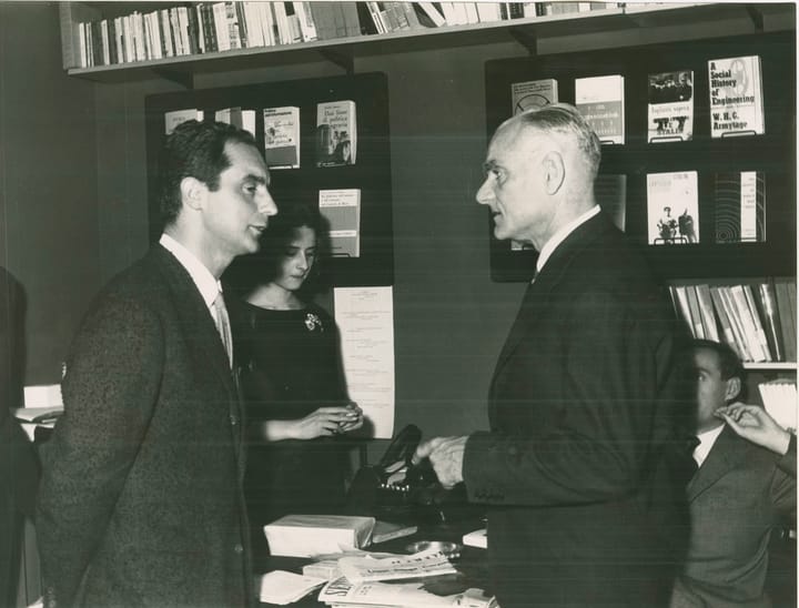 Portrait or photograph of Italo Calvino: The italian writers Italo Calvino and Alberto Moravia photographed at the Einaudi bookstore on Via Vittorio Veneto in R
