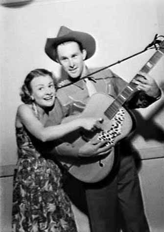 Portrait or photograph of Bletchley Park's Joan Clarke: Country singer Reg Lindsay and Joan Clarke on the Hour of Song radio program, 2UW Radio Theatre, Sydney