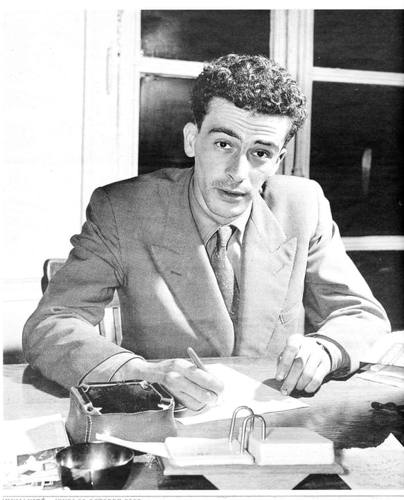 Portrait or photograph of Kateb Yacine: Kateb Yacine 1956 - autographing Nedjma
