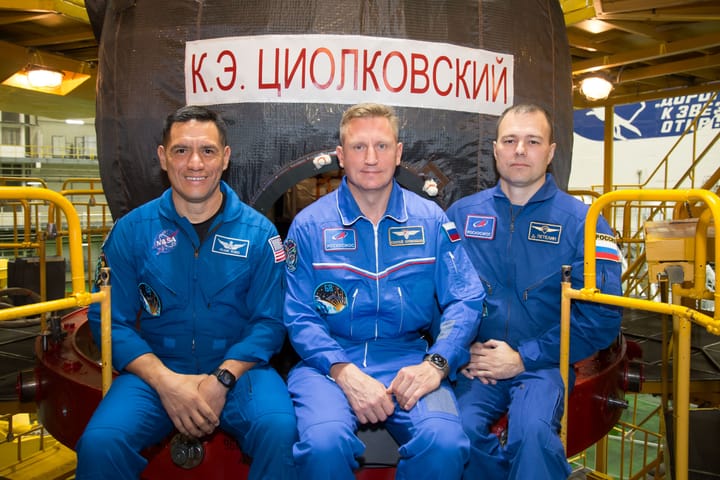 Portrait or photograph of Konstantin Tsiolkovsky: jsc2022e072268 (Sept. 7, 2022) --- At the Baikonur Cosmodrome in Kazakhstan, NASA astronaut Frank Rubio (left)
