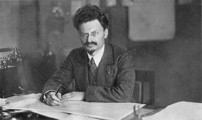 Portrait or photograph of Leon Trotsky: Leon Trotsky at his desk.