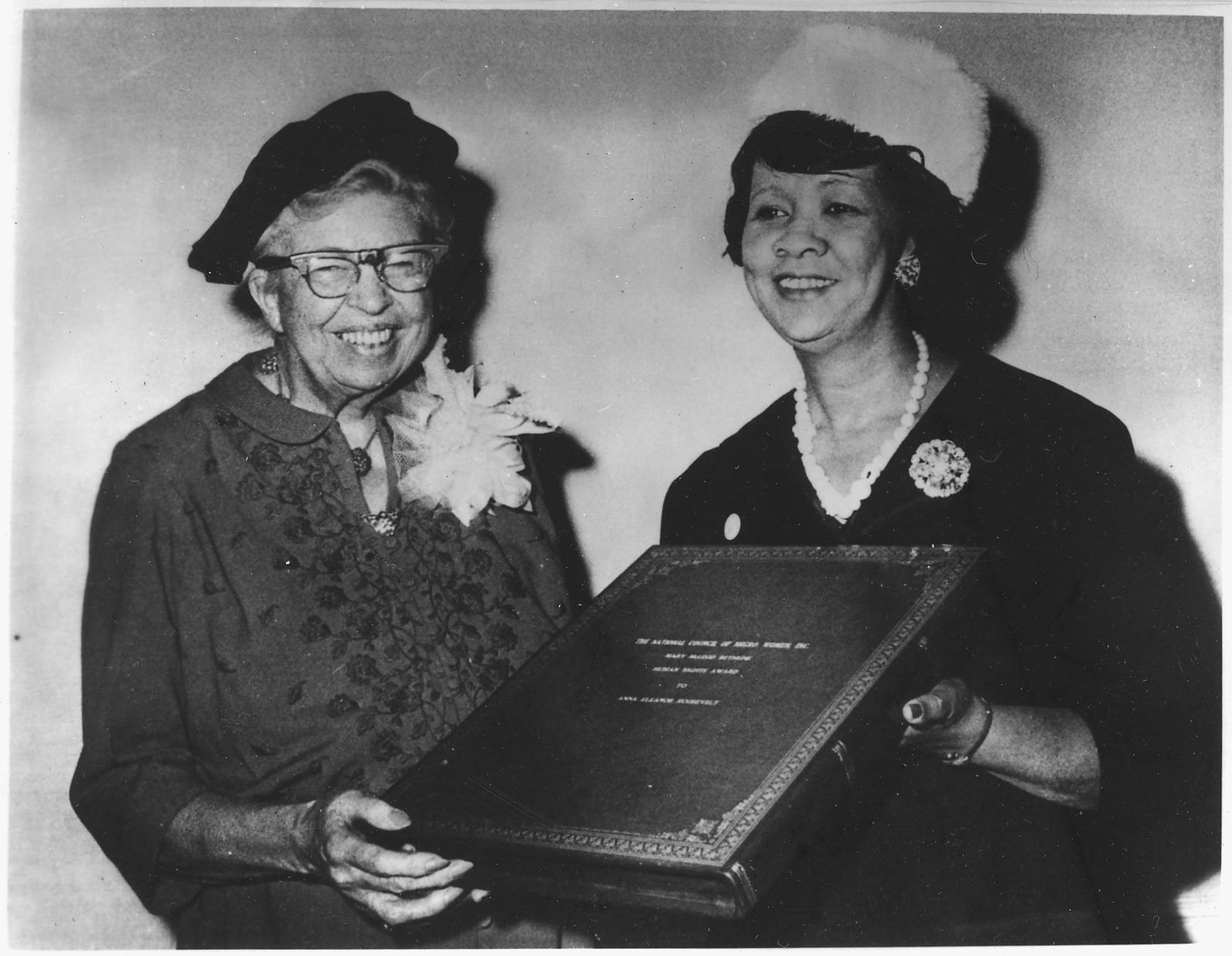 Portrait or photograph of Mary McLeod Bethune: Eleanor Roosevelt receiving the Mary McLeod Bethune Human Rights Award from Dorothy Height, president of the Nati