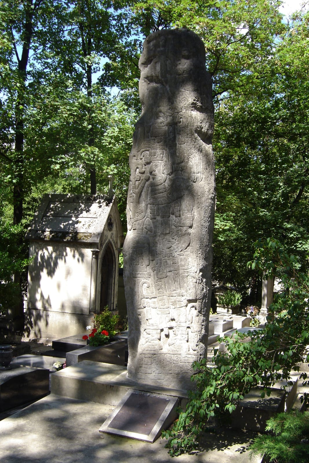 Portrait or photograph of Miguel Angel Asturias: Miguel Angel Asturias' grave marker as a Mayan stela, Cimetière du Père-Lachaise, Paris, France