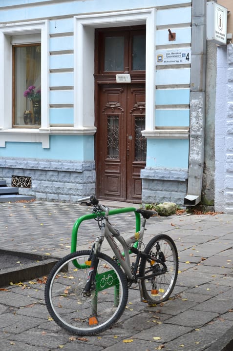 Portrait or photograph of Mikhail Hrushevsky: Bicycle park near the apartment building № 4 on the street. Mykhailo Hrushevsky in Ternopil, Ukraine.