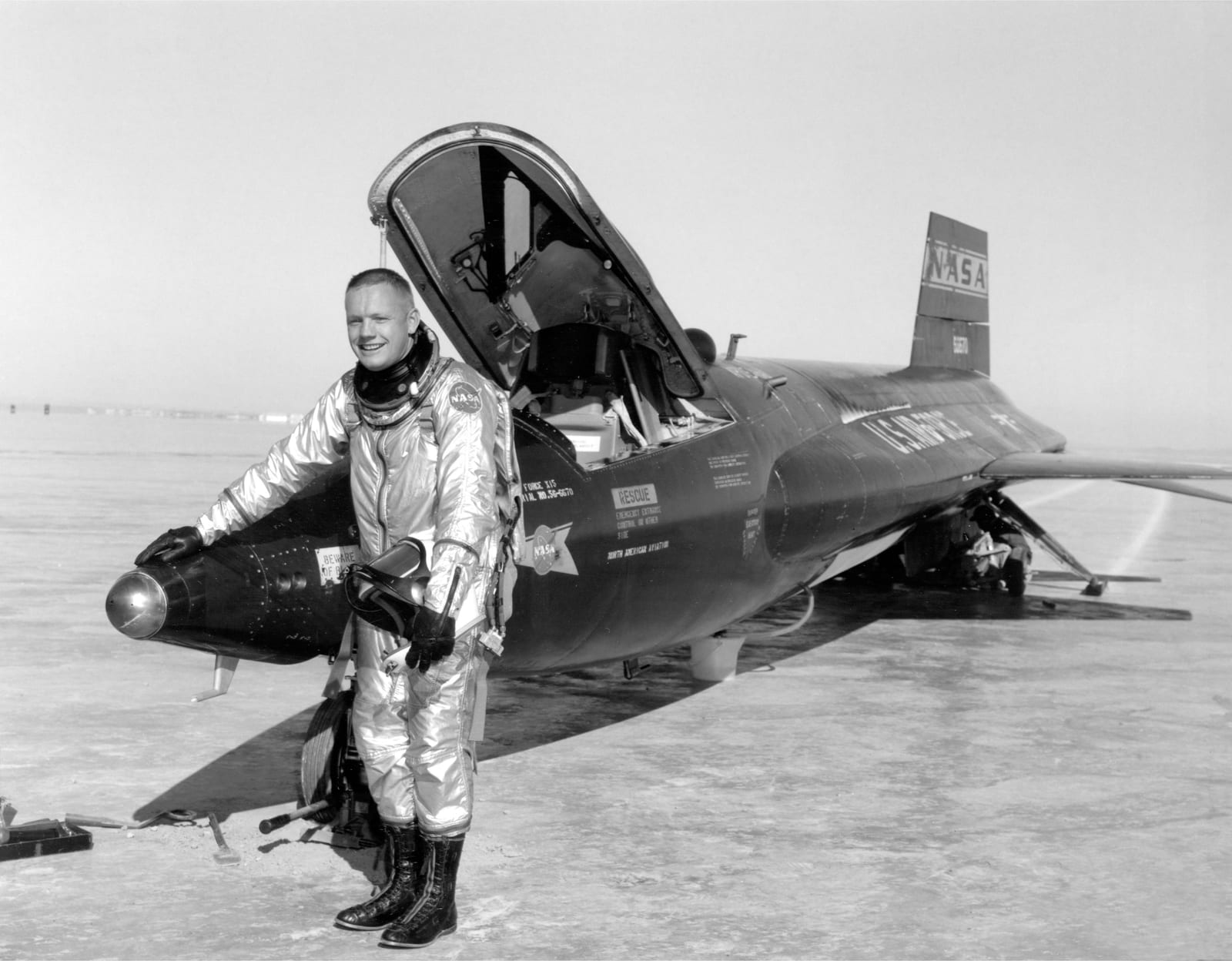 Portrait or photograph of Neil Armstrong: Dryden pilot Neil Armstrong is seen here next to the X-15 ship #1 (56-6670) after a research flight. Armstrong made hi