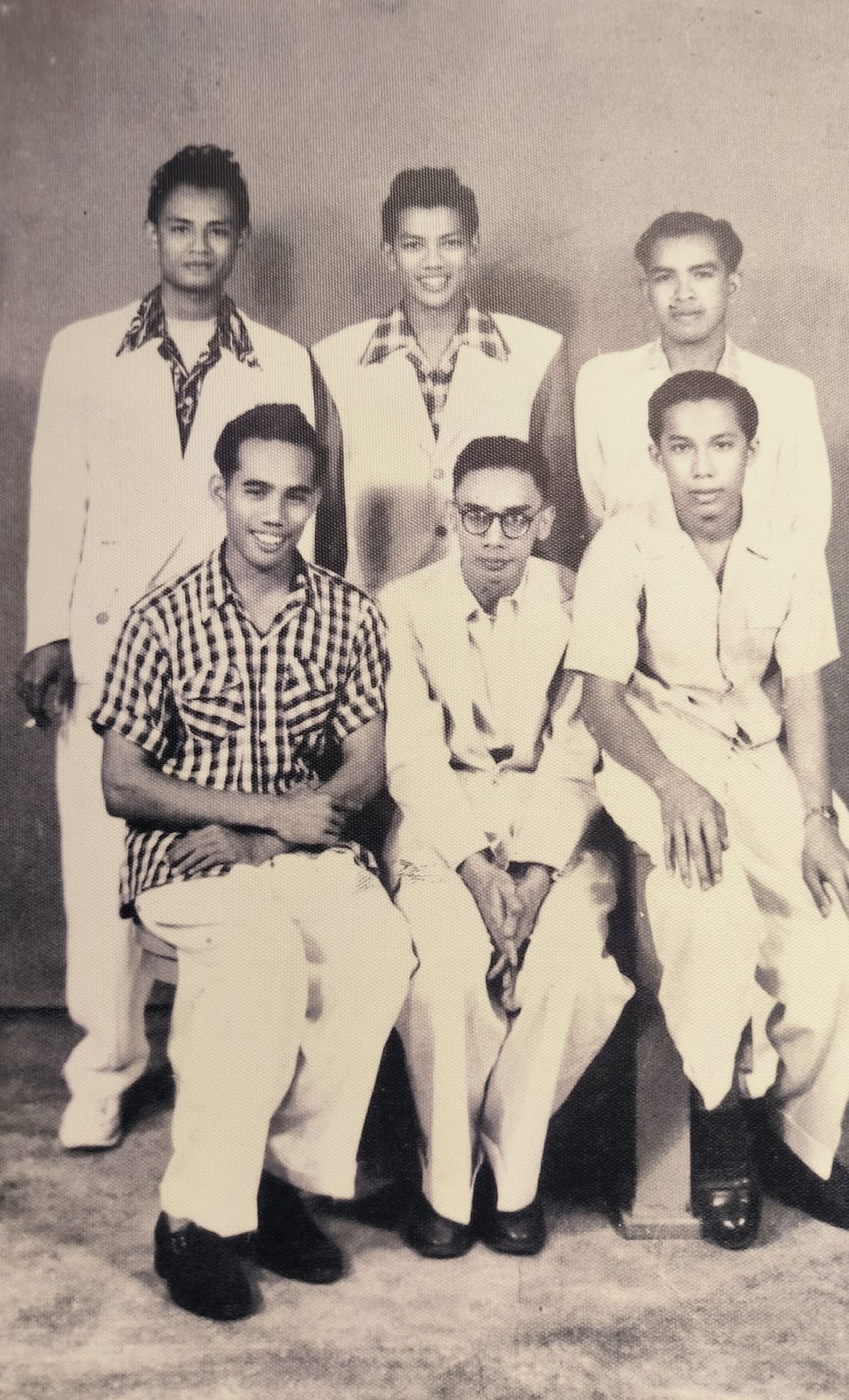 Portrait or photograph of P. Ramlee: P. Ramlee and his friends upon arrival at Jalan Ampas, Singapore.