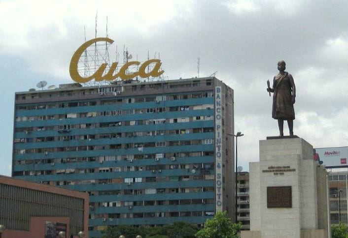 Portrait or photograph of Queen Nzinga: Cuca Building and the statue of Queen Mwane Njinga Mbande, Luanda, Angola .