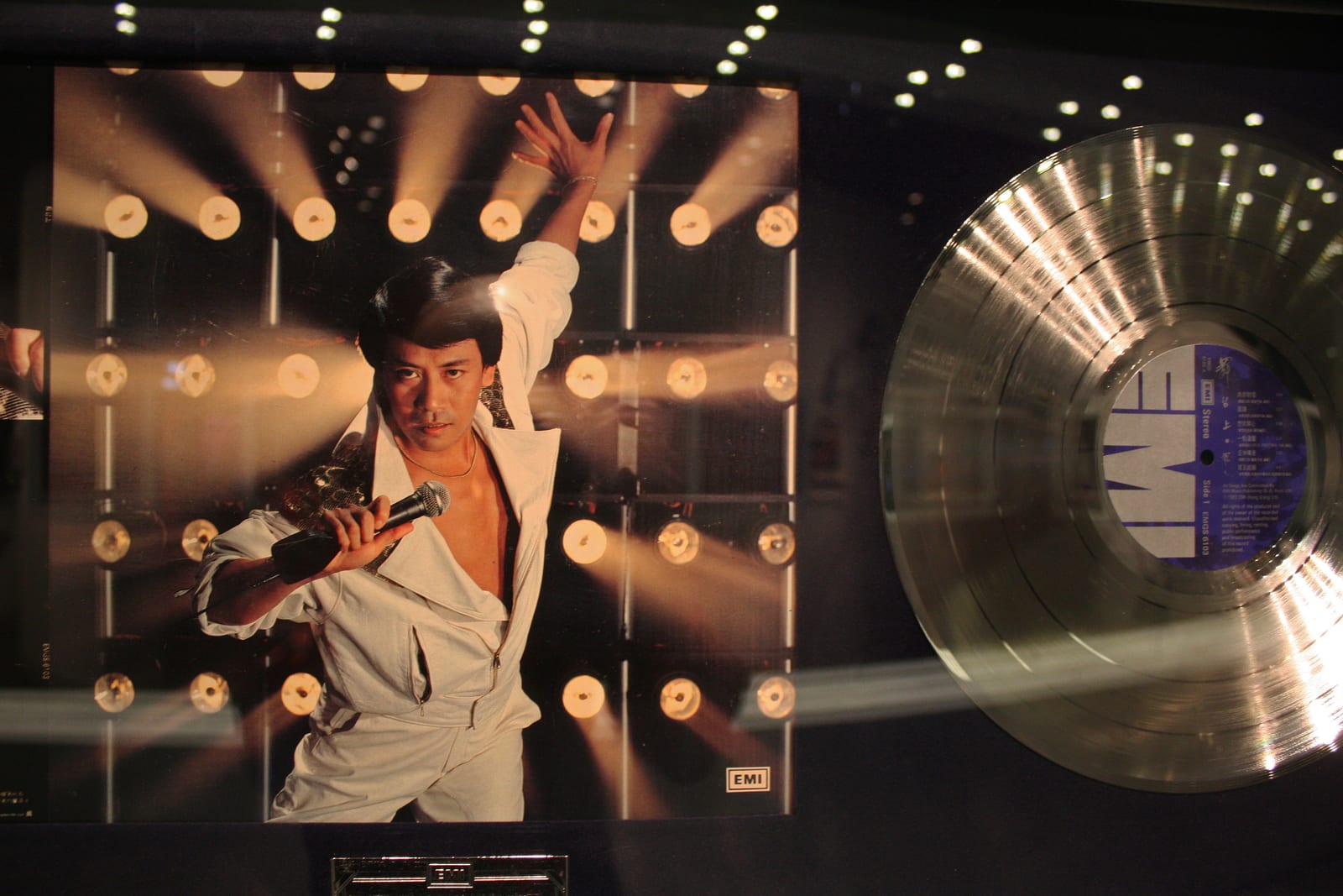 Portrait or photograph of Roman Tam: Roman Tam album on display at the Hong Kong Heritage Museum's exhibit: Applauding to Hong Kong Pop Legend: Roman Tam