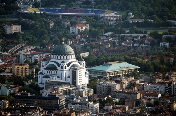 Portrait or photograph of Saint Sava: Cathedral of Saint Sava and the National Library of Serbia.