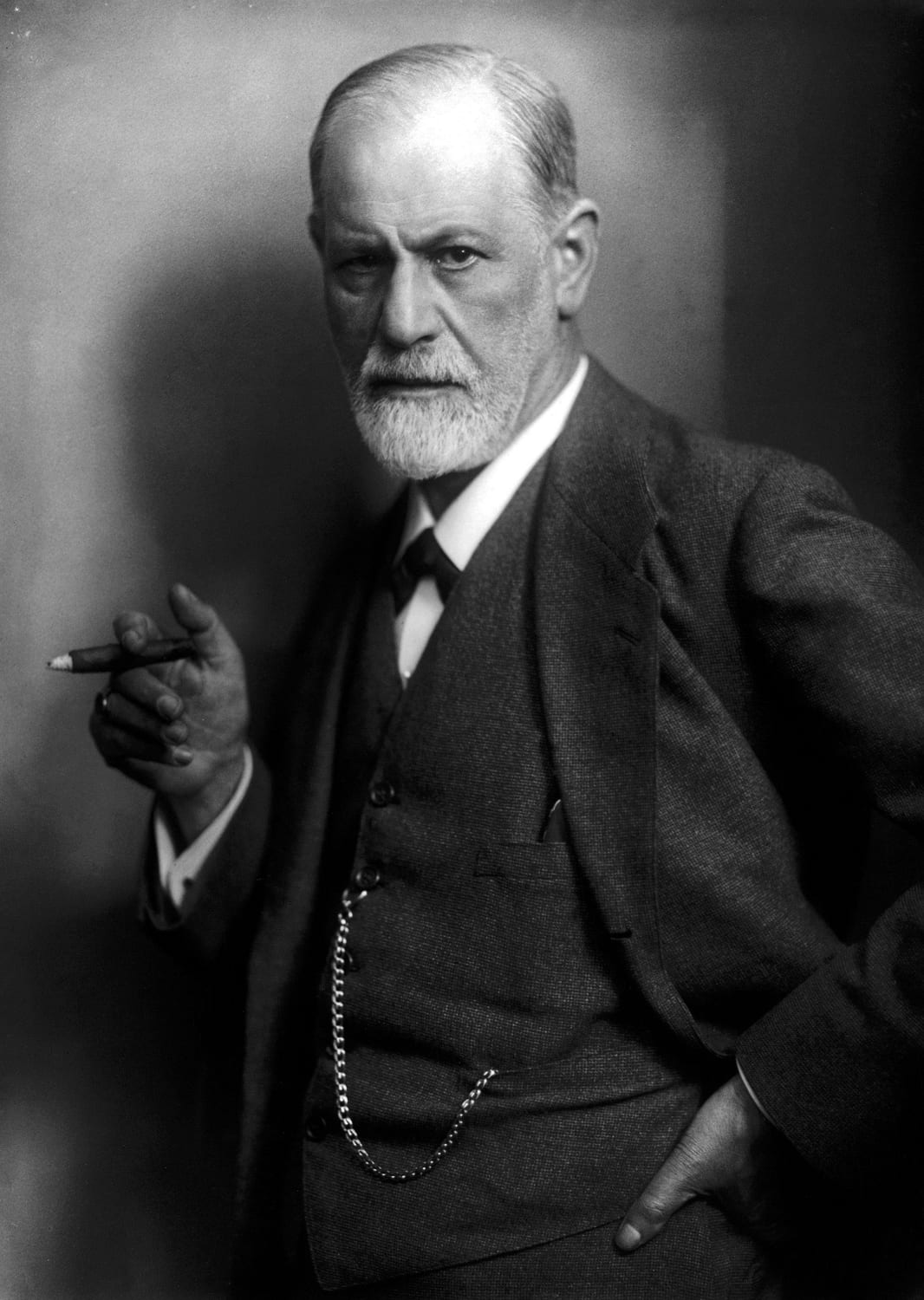 Portrait or photograph of Sigmund Freud: Sigmund Freud , founder of psychoanalysis, holding a cigar. Photographed by his son-in-law, Max Halberstadt, c. 1921