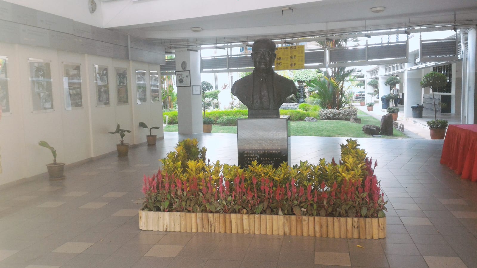 Portrait or photograph of Tan Kah Kee: The head statue of the institution founder Mr Tan Kah Kee, over the background of the front garden. Picture taken amid th