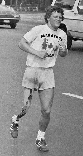 Portrait or photograph of Terry Fox: Photo of Terry Fox , Canadian cancer fund-raiser, during his 1980 "Marathon of Hope" fund-raising run across Canada. Photo