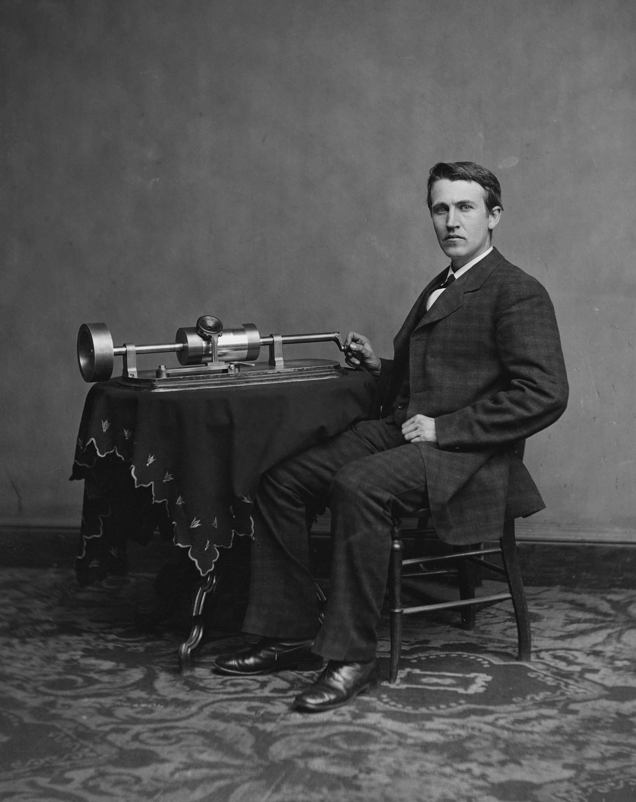 Portrait or photograph of Thomas Edison: Thomas Edison and his early phonograph. Cropped from Library of Congress copy.