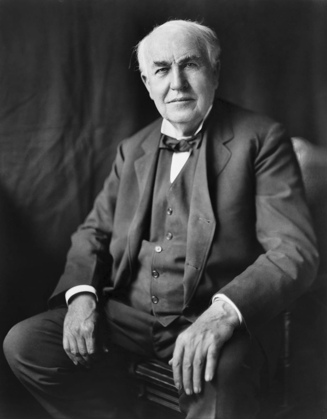 Portrait or photograph of Thomas Edison: "Thomas Alva Edison, three-quarter length portrait, seated, facing front". Photographic print.