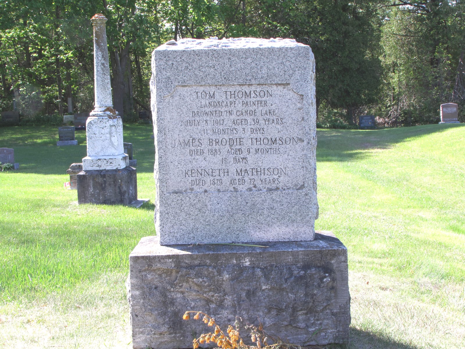 Portrait or photograph of Tom Thomson: HDR image of the headstone of Tom Thomson, Canadian painter.
