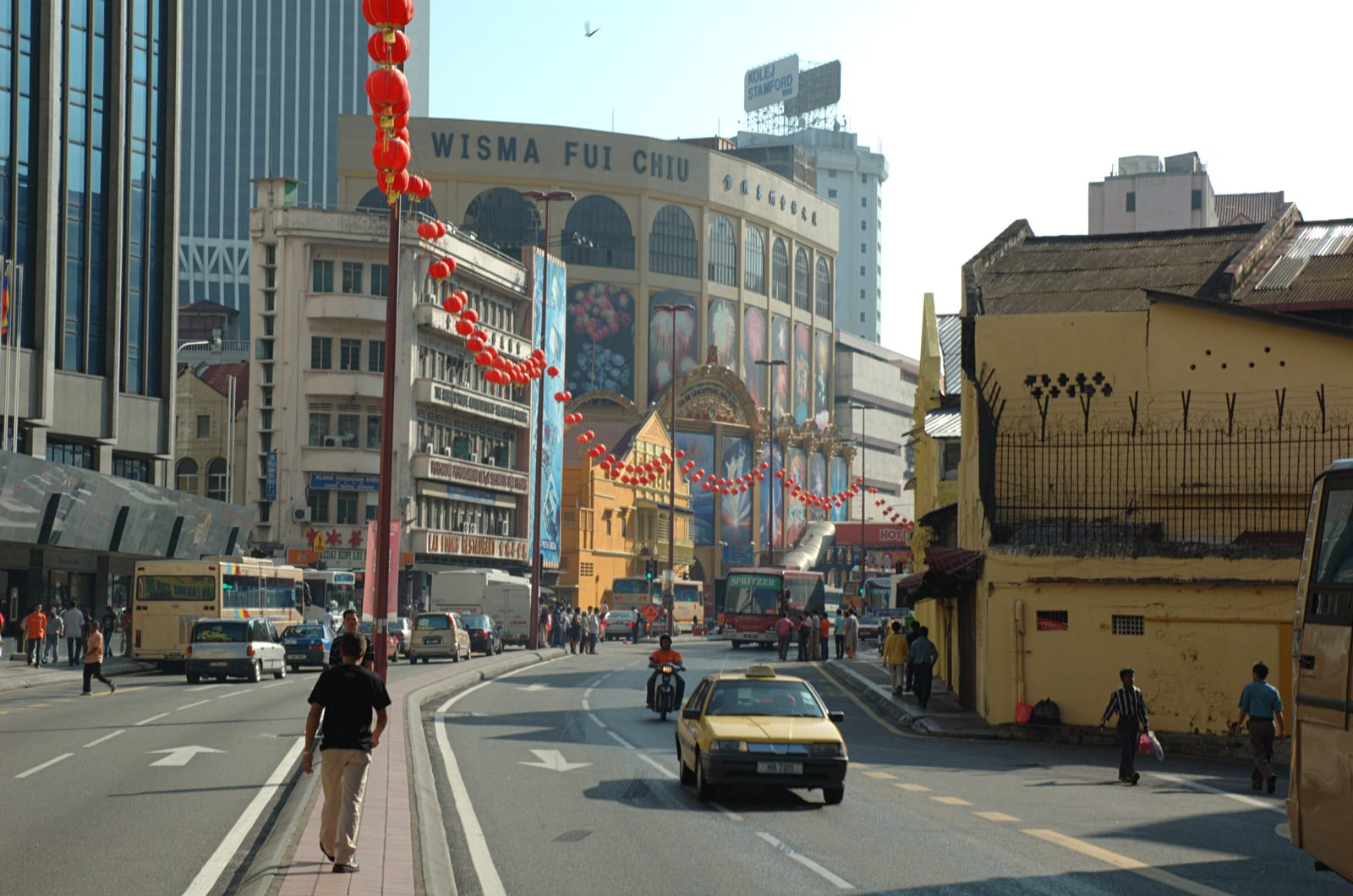 Portrait or photograph of Tun Tan Cheng Lock: Jalan Tun Tan Cheng Lock, looking across the intersection with Jalan Tun H S Lee towards Wisma Fui Chiu. Kuala Lum