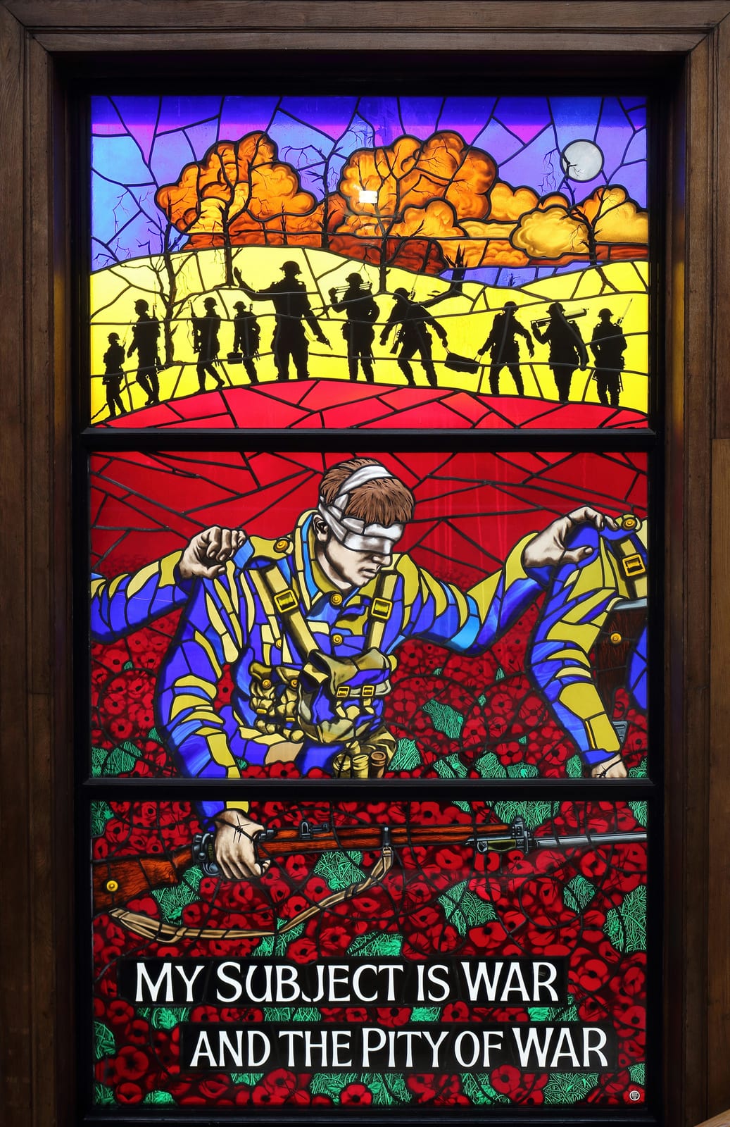 Portrait or photograph of Wilfred Owen: The window memorial to Wilfred Owen in the stairwell of Birkenhead Central Library