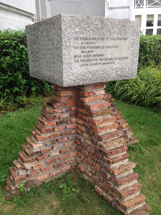 Portrait or photograph of Yusof Ishak: The foundation stone of the Monument of the Early Founders of Singapore in the grounds of The Fullerton Hotel Singapore .