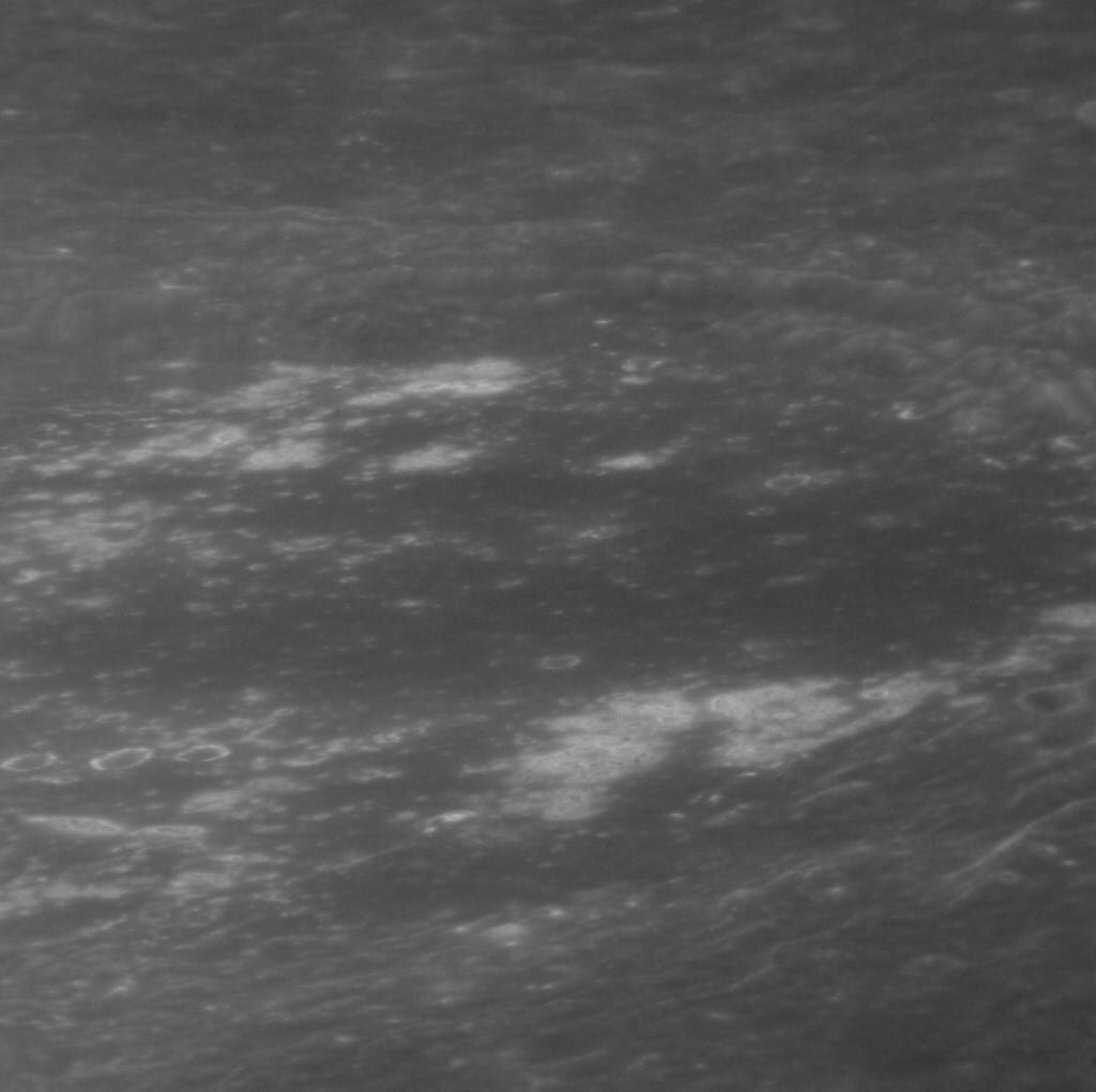 Portrait or photograph of Zeami Motokiyo: Oblique view across northern Zeami crater on Mercury. The bright areas are hollows. MESSENGER Narrow Angle Camera. Nor