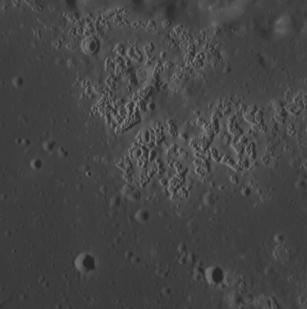 Portrait or photograph of Zeami Motokiyo: Hollows in northern Zeami crater on Mercury. MESSENGER Narrow Angle Camera. Image width is about 23.2 km. North is up.