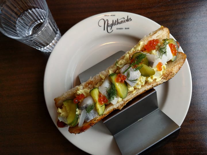Photograph or image of Pickles: Minneapolis, Minnesota. With fish, roe, egg salad, pickles.