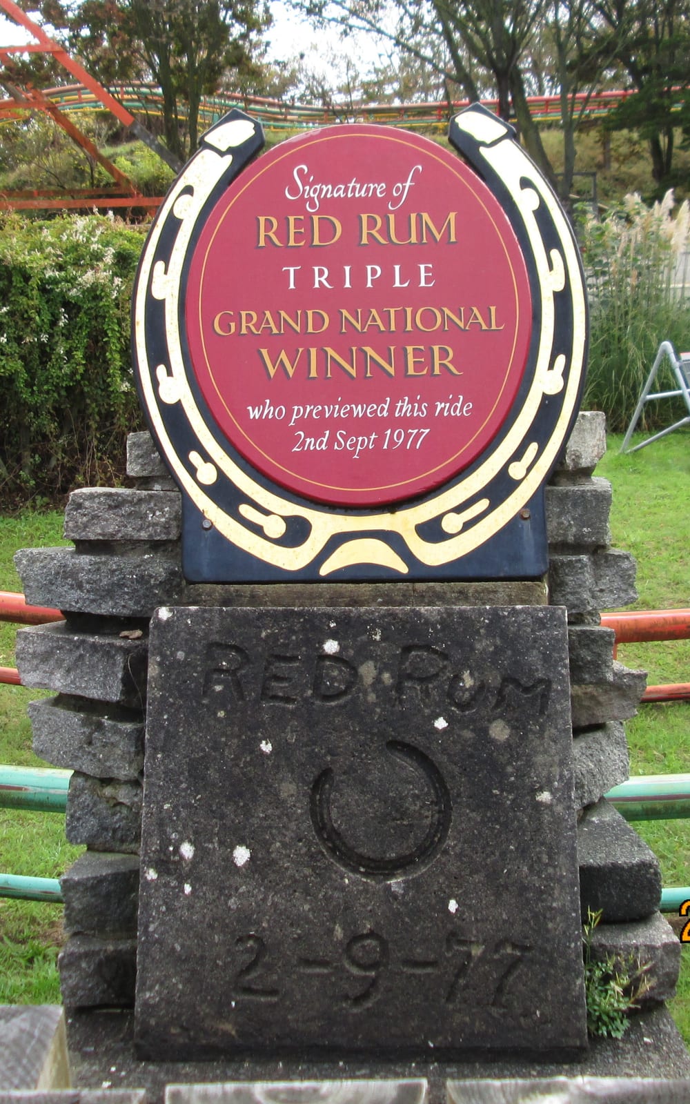 Photograph or image of Red Rum: Red Rum's hoofprint at Blackpool Pleasure Beach. Text on sign: "Signature of RED RUM TRIPLE GRAND NATIONAL WINNER who previewed