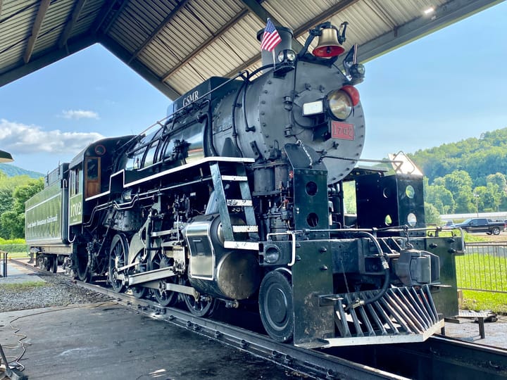 Photograph or image of Smoky: Great Smoky Mountains Railroad 1702 is an S160 class 2-8-0 "Consolidation" type steam locomotive built in September 1942 by the Ba