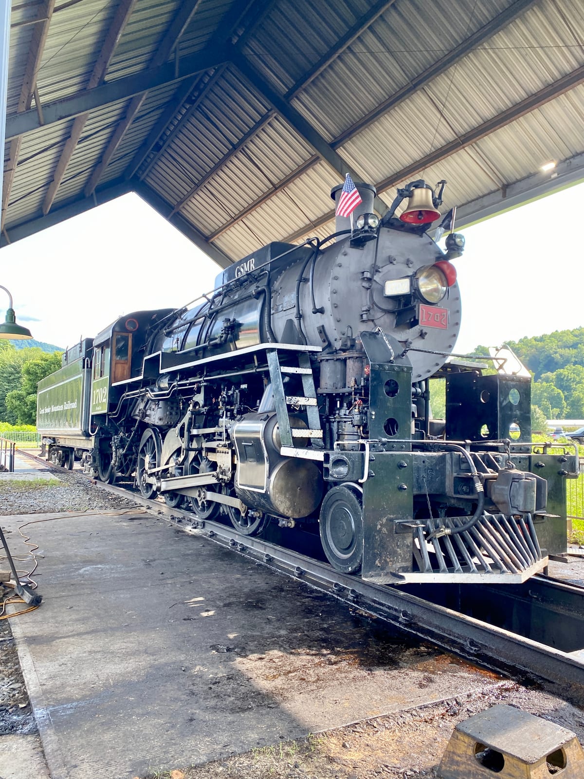 Photograph or image of Smoky: Great Smoky Mountains Railroad 1702 is an S160 class 2-8-0 "Consolidation" type steam locomotive built in September 1942 by the Ba